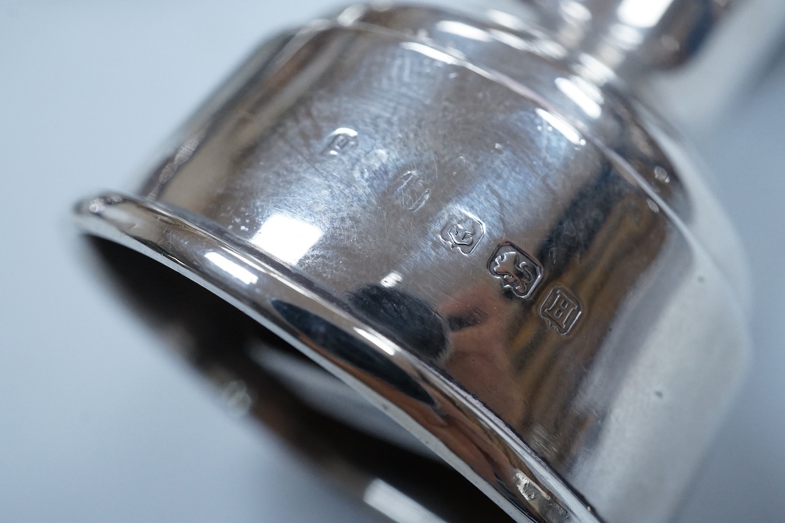 Two modern silver mounted pepper mills, 10.5cm, one other silver pepper mill by Hukin & Heath, Birmingham, 1926 and a pair of George III silver bun shaped salts, David Hennell I, London, 1750, with blue glass liners.